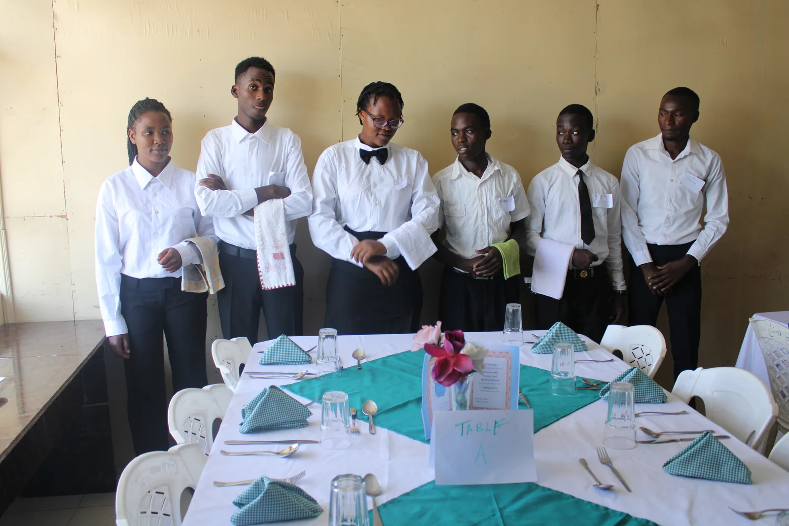 Germaine Training Institute hospitality trainees at a practical service setup