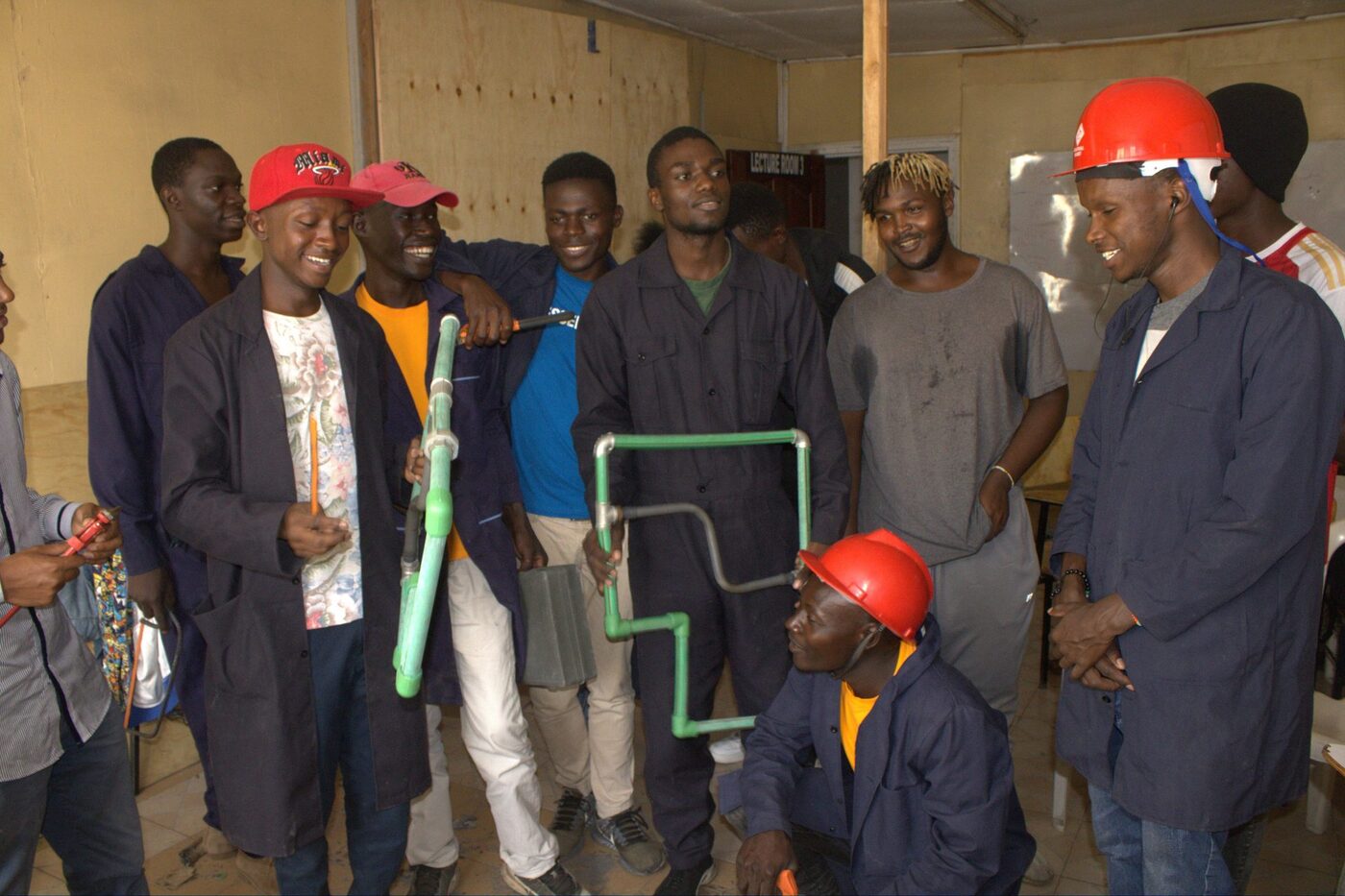 Building & construction trainees practising pipework in a Germaine workshop