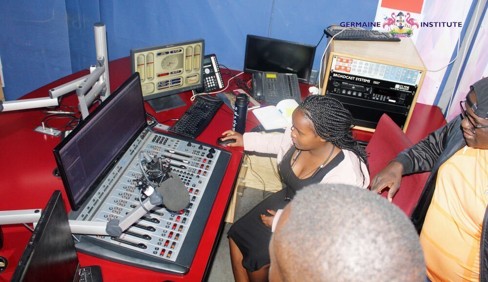Trainees at the broadcast console in the Germaine studio