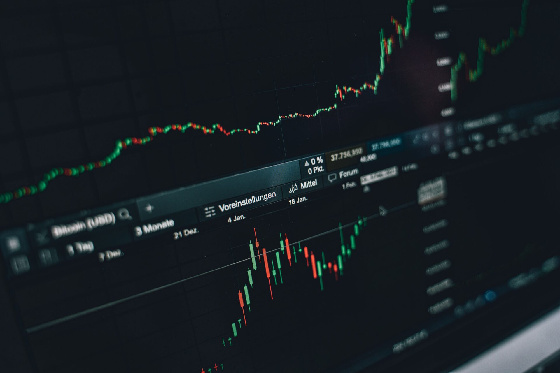 Professional analyzing marketing performance charts and trend lines on a tablet